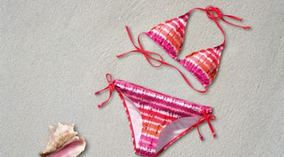 The picture shows bikini sets on the beach
